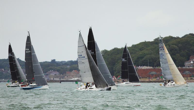 The 2019 Rolex Fastnet Race fleet pass Hurst Casle photo copyright Mark Jardine taken at Royal Ocean Racing Club and featuring the IRC class