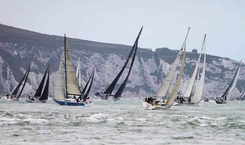 The 2019 Rolex Fastnet Race fleet pass Hurst Casle photo copyright Mark Jardine taken at Royal Ocean Racing Club and featuring the IRC class