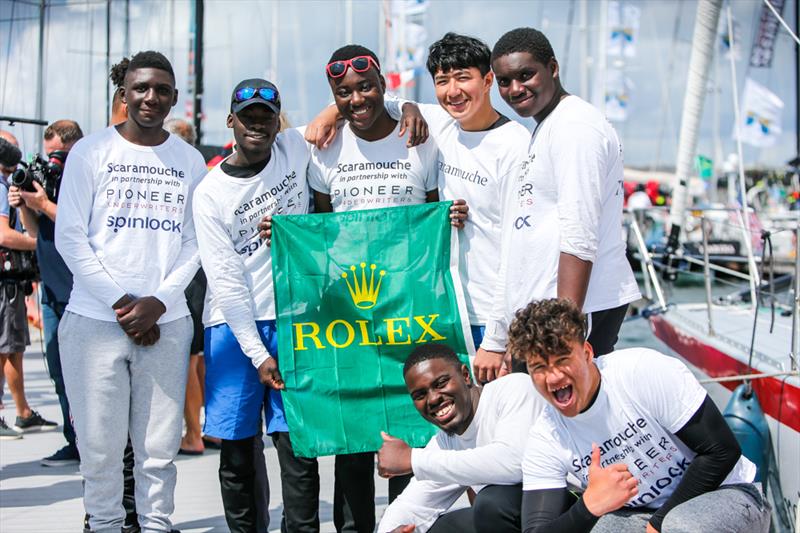 The Scaramouche team celebrate at the end of the Rolex Fastnet Race 2019 photo copyright Paul Wyeth / www.pwpictures.com taken at  and featuring the IRC class