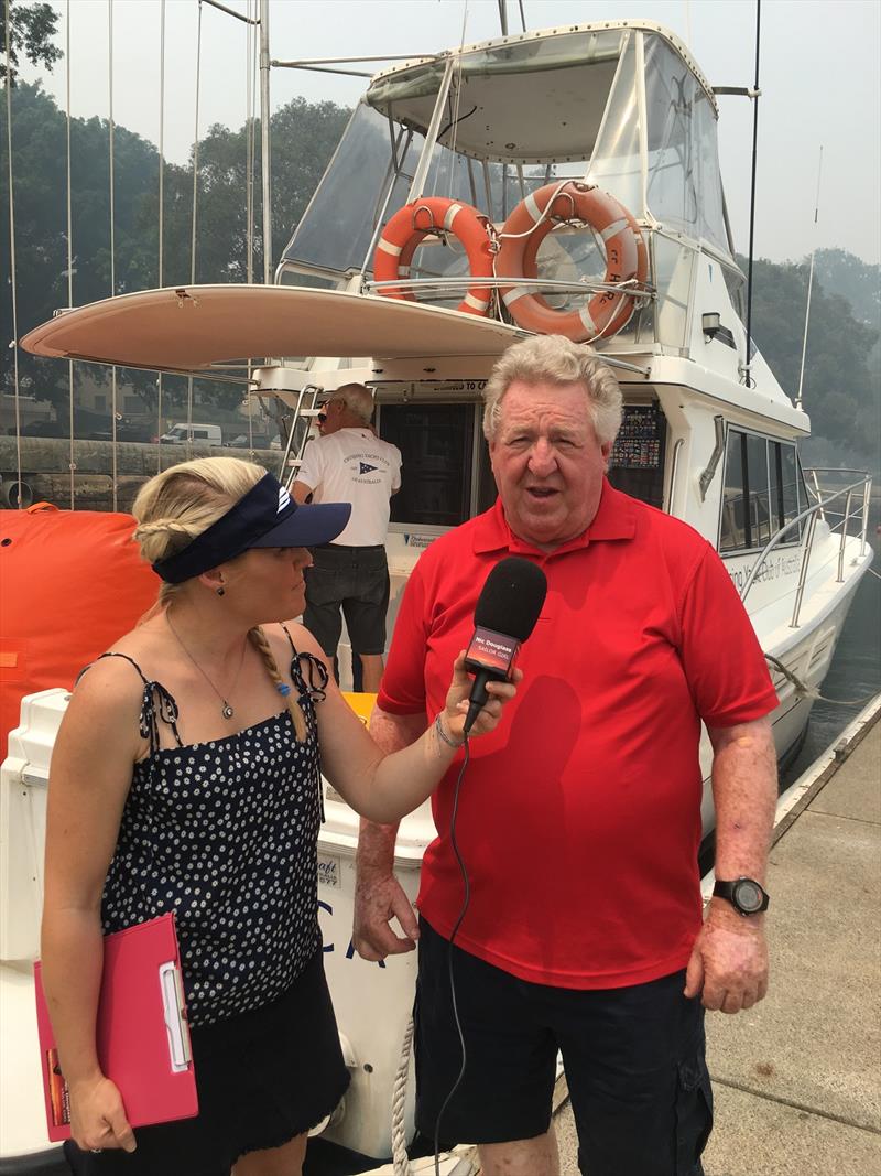 Sailor Girl interviews Denis Thompson surrounded by smoke at Grinders Coffee SOLAS Big Boat Challenge photo copyright Nic Douglass taken at Cruising Yacht Club of Australia and featuring the IRC class
