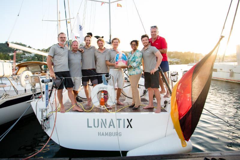 German XP-50 Lunatix is welcomed by the Grenada Tourism Authority with a basket of Grenadian produce photo copyright RORC / Arthur Daniel taken at Royal Ocean Racing Club and featuring the IRC class
