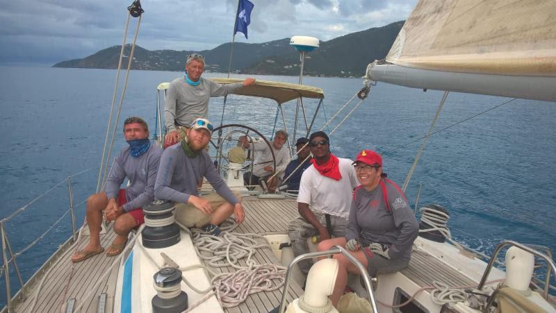 Local Tortolan crew on the Swan 51 Godspeed reaching toward Steele Point on the north side of Tortola, BVI finally enjoying a light breeze after a long day on the water  photo copyright Michelle Slade / Event Media taken at Royal BVI Yacht Club and featuring the IRC class