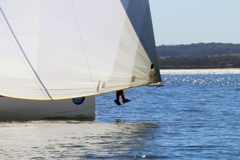 Super 12 becalmed before the storm photo copyright Mark Rothfield taken at Corlette Point Sailing Club and featuring the IRC class