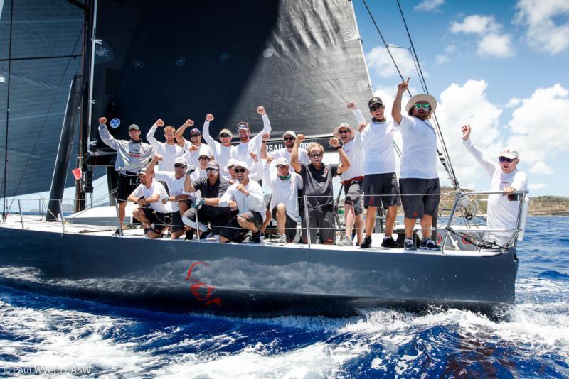 Warrior crew celebrate winning the Peters & May Trophy for the Round Antigua Race - 2018 Antigua Sailing Week photo copyright Paul Wyeth / pwpictures.com taken at Antigua Yacht Club and featuring the IRC class