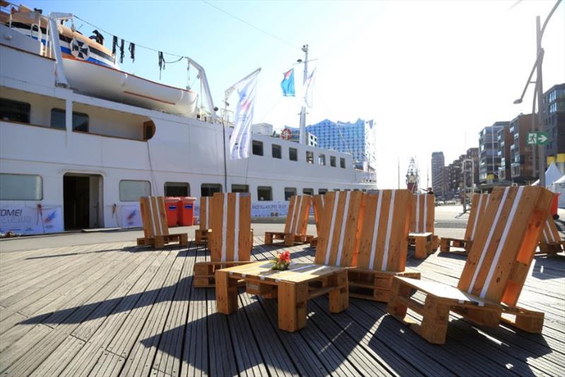 AAR Race Village Lounge in front of Race Club Ship Seute Deern and the iconic Elbphilharmonie in Hamburg - Bermuda Hamburg Race of the Atlantic Anniversary Regatta 2018 photo copyright Michael Meyer / AAR taken at Yacht Club Costa Smeralda and featuring the IRC class