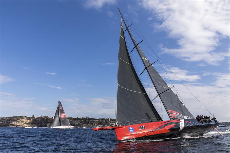 Comanche gets that angle of heel going to reduce wetted surface area, with Wild Oats XI in the background photo copyright Andrea Francolini taken at Cruising Yacht Club of Australia and featuring the IRC class