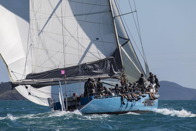 Phil 'Cub' Barnett co-opts fellow former skiffes to sail Hammer of Queensland - Airlie Beach Race Week 2018 photo copyright Andrea Francolini taken at Whitsunday Sailing Club and featuring the IRC class