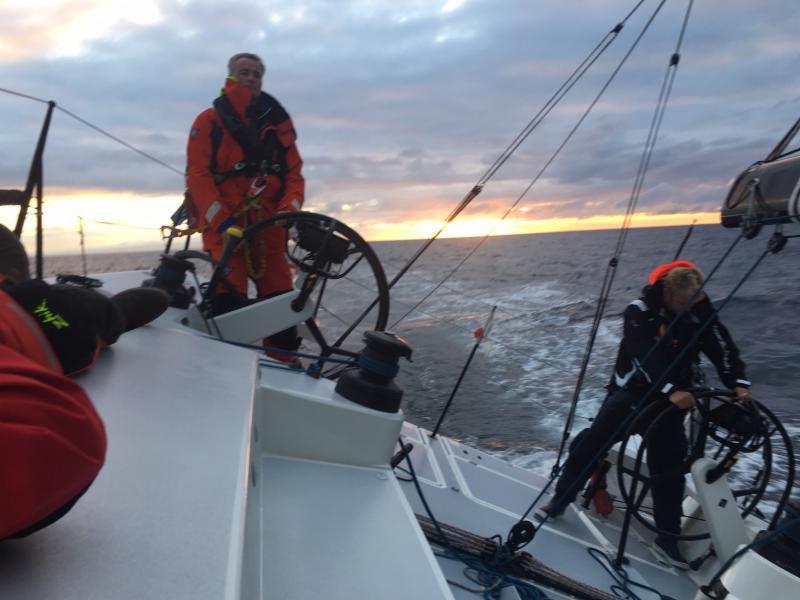 Giles Redpath at the wheel of Pata Negra at sunrise - photo © Chris Hanson