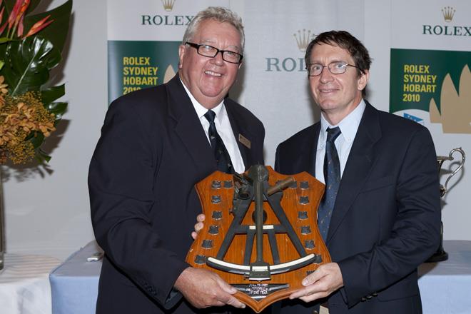 Garry Linacre presents Will Oxley with Navgator of the Year trophy - Sealink Magnetic Island Race Week photo copyright Andrea Francolini taken at Townsville Yacht Club and featuring the IRC class