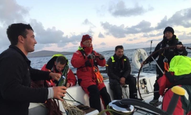 Celebrations on board Arthur Logic after rounding Muckle Flugga in the Sevenstar Round Britain and Ireland Race photo copyright Arthur Logic taken at Royal Ocean Racing Club and featuring the IRC class