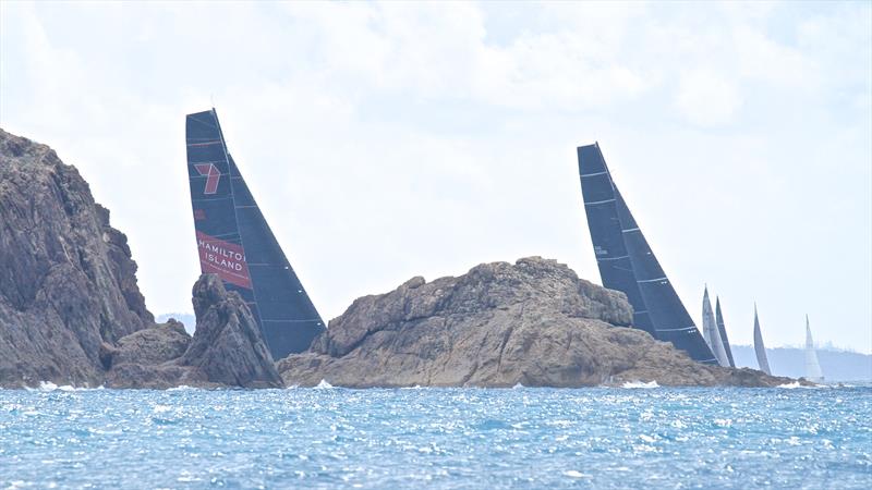 The super maxis lead around Baynham Island, Hamilton Island Race Week - Day 6 photo copyright Richard Gladwell taken at Hamilton Island Yacht Club and featuring the IRC class