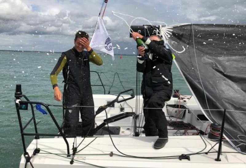 Champagne celebrations dockside: Friends, family and the RORC Race Team were on the dock to welcome the two handed team on Tigris photo copyright RORC taken at Royal Ocean Racing Club and featuring the IRC class