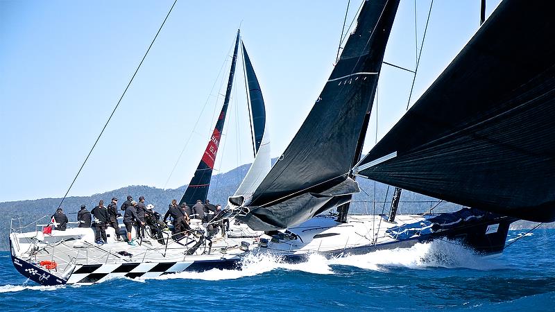 The supermaxi Black Jack sets up to leeward of Wild Oats XI - Hamilton Island Race Week - August - photo © Richard Gladwell