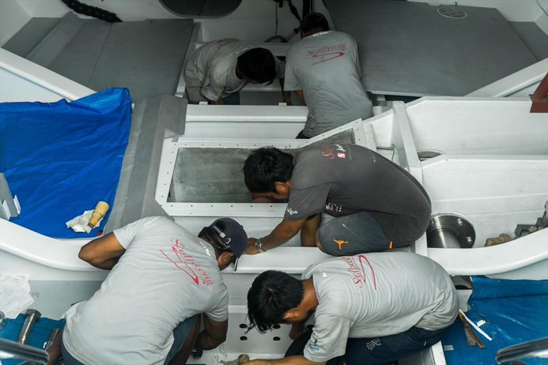 Working on the canting keel ram - Team Scallywag reassembles after refit in Hong Kong, September 2018 - photo © Team Scallywag