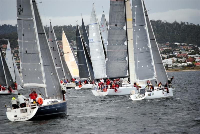 The 16 boat fleet hits the line at Friday's evening's start of the Maria Island Race. - photo © Peter Campbell