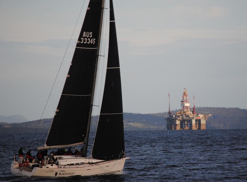 A huge oil rig anchored in the middle of the River Derwent presented an obstacle for the fleet heading down the river photo copyright Peter Campbell taken at Royal Yacht Club of Tasmania and featuring the IRC class