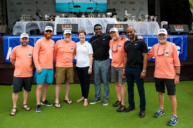 KPMG principals fraternizing with yacht crew during KPMG afternoon prize giving ceremony. - photo © Antigua Sailing Week