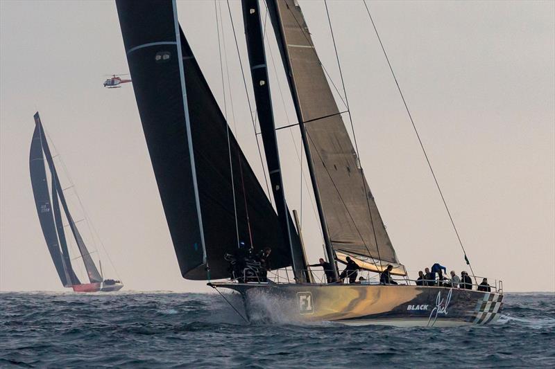 Black Jack with Comanche to leeward - Finish 2018 Rolex Sydney Hobart Race photo copyright Rolex taken at Cruising Yacht Club of Australia and featuring the IRC class