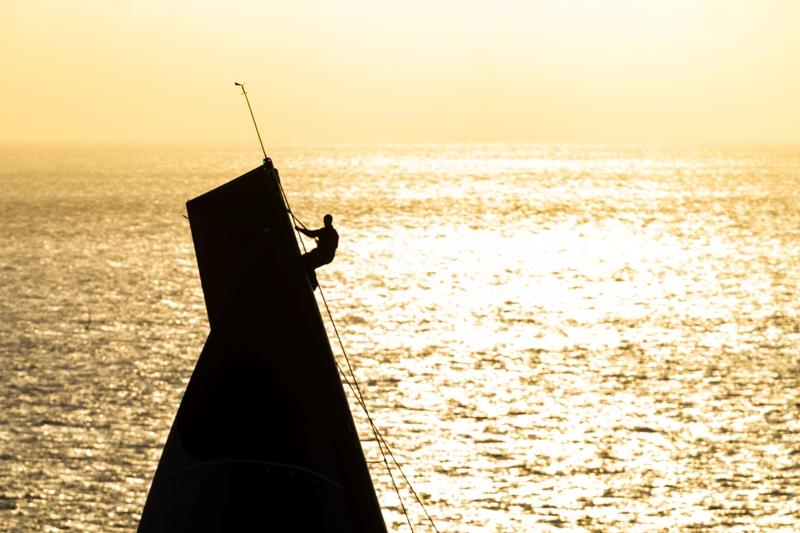 A sailor on Comanche climbs the mast to help the crew prepare for their next tactical decision at the 2018 Rolex Sydney Hobart Yacht Race photo copyright Rolex / Studio Borlenghi taken at Cruising Yacht Club of Australia and featuring the IRC class