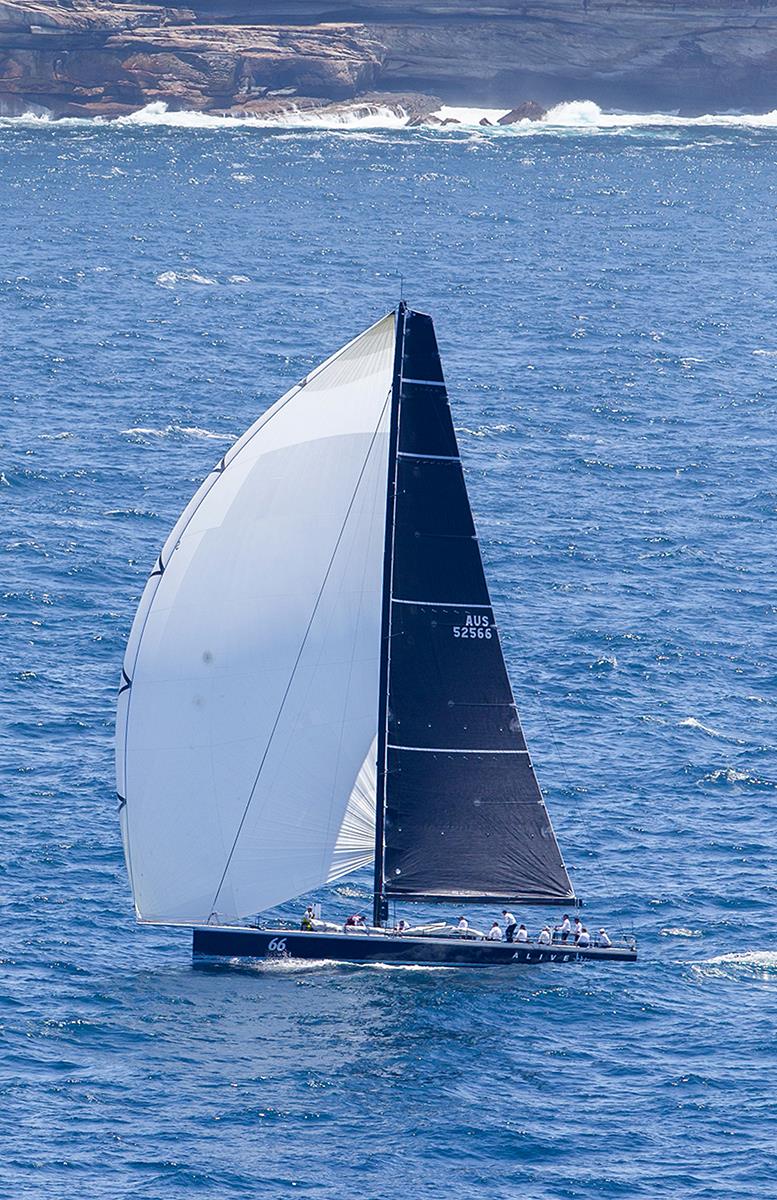 Alive runs South from Sydney Heads photo copyright Crosbie Lorimer taken at Cruising Yacht Club of Australia and featuring the IRC class