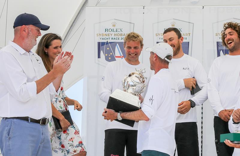 Alive's owner Phillip Turner holds the Tattersall Cup photo copyright Crosbie Lorimer taken at Cruising Yacht Club of Australia and featuring the IRC class