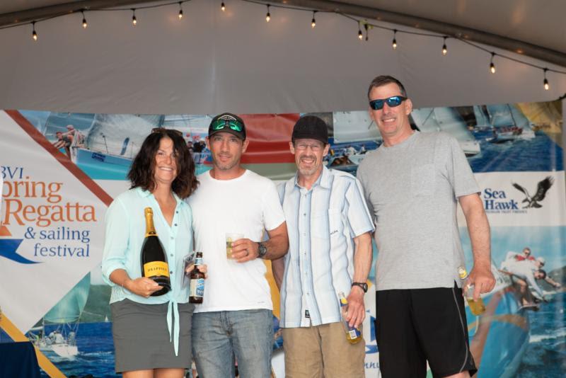 Miles Sutherland-Pilch, Nanny Cay presents prizes to some of the Fujin crew - Round Tortola Race 2019 photo copyright Alastair Abrehart taken at Royal BVI Yacht Club and featuring the IRC class