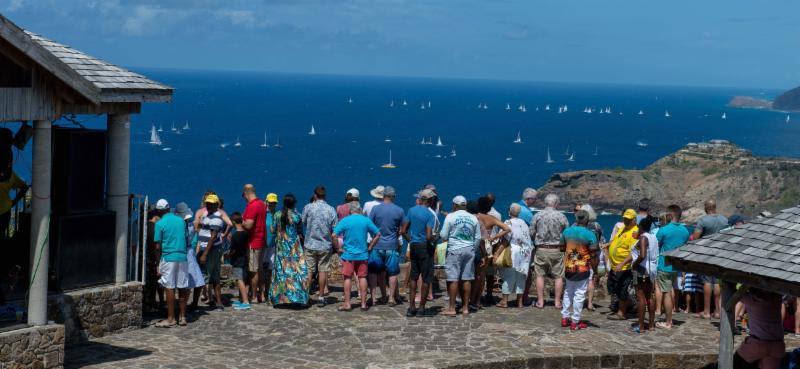 Race fans watched the action from Shirley Heights Lookout - English Harbour Rum Race photo copyright Ted Martin taken at Antigua Yacht Club and featuring the IRC class