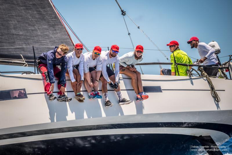 The crew of Pata Negra win the Warrior Trophy for best IRC boat on corrected time in the '19 Antigua Bermuda Race photo copyright Tobias Stoerkle taken at Royal Bermuda Yacht Club and featuring the IRC class