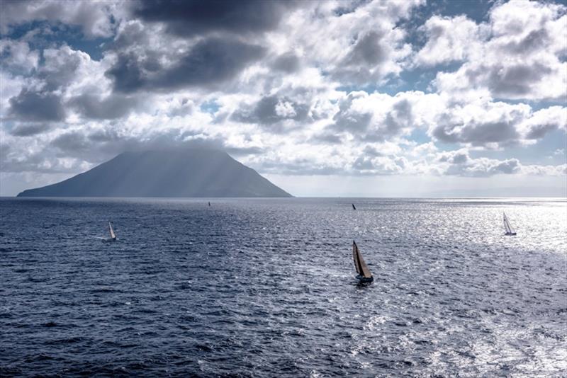 Fleet passing the active volcano of Stromboli - Rolex Middle Sea Race 2018 - photo © Rolex / Kurt Arrigo 