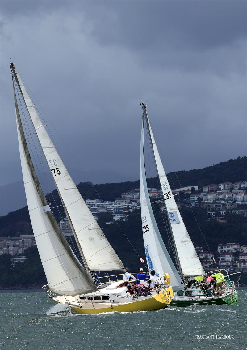 Dramatic backdrop for Gecko and Sleeepy Pigggy (UK Sailmakers Typhoon Series , Race 4) photo copyright Fragrant Harbour taken at Hebe Haven Yacht Club and featuring the IRC class