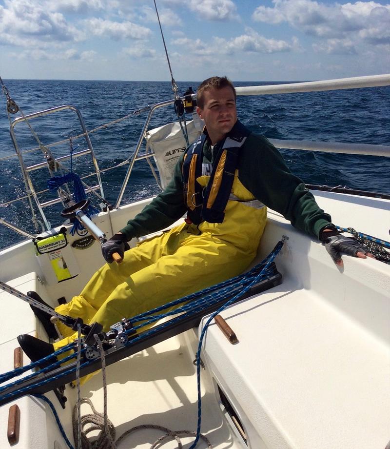 Cameron Benedict at the helm of Shape during the 2014 Bell's Beer Bayview Mackinac Race, which his team won photo copyright Win Cooper III taken at  and featuring the IRC class