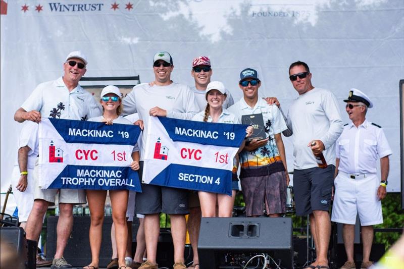 Team Chico 2 accepting its Chicago Mackinac Trophy and Section 4 flags photo copyright Ellinor Walters taken at  and featuring the IRC class