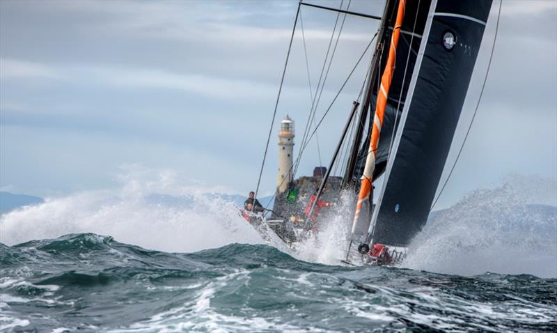 The 30.48 metre (100 foot) SHK Scallywag is dwarfed by steep seas as she rounds the Fastnet Rock - 2019 Rolex Fastnet Race - photo © Rolex / Kurt Arrigo 