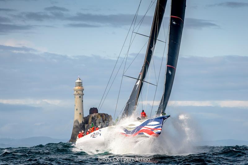 Wizard at Fastnet Rock, overall winner of the 2019 Rolex Fastnet Race - August 2019 photo copyright Kurt Arrigo / Rolex taken at Royal Ocean Racing Club and featuring the IRC class