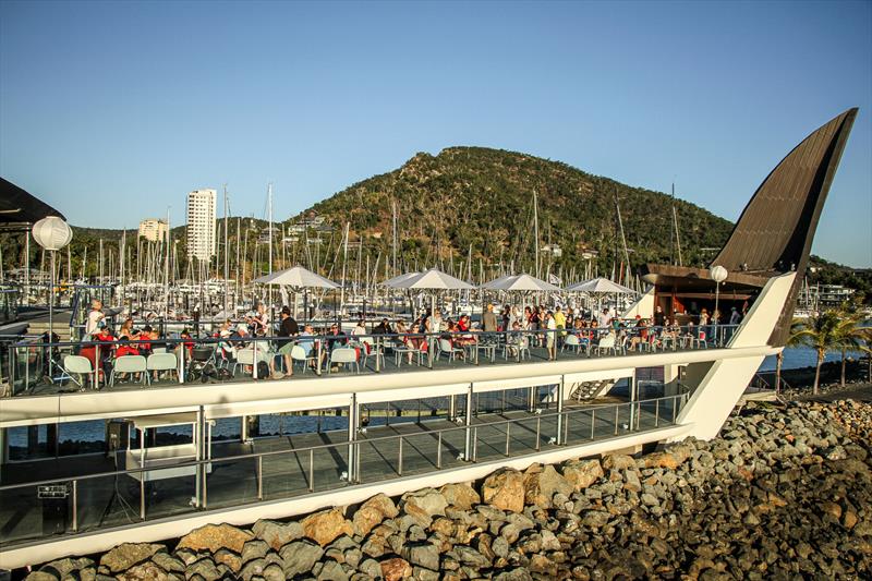 The deck of the Hamilton island Yacht Club - with the marina behind - Hamilton Island Race Week 2019 photo copyright Richard Gladwell taken at Hamilton Island Yacht Club and featuring the IRC class