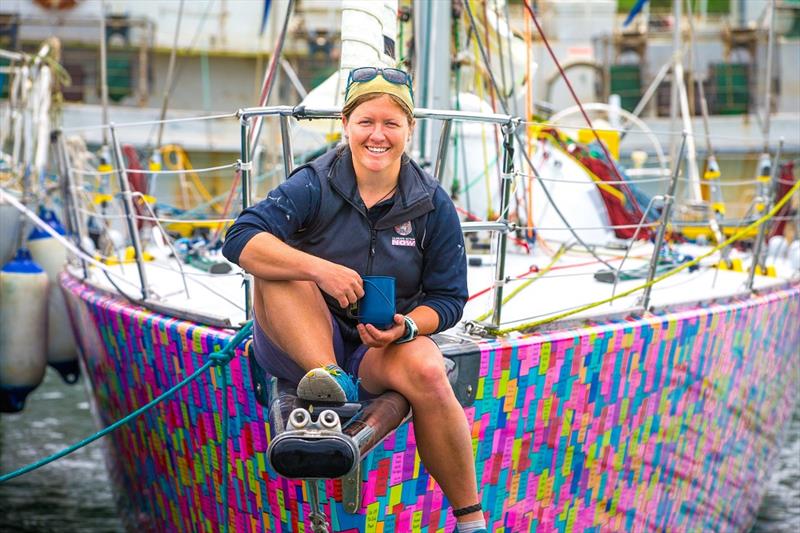 Lisa Blair on bow of her boat - photo © Dean Coopman