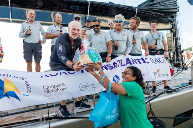 A fantastic welcome on the dock for Dark Shadow team at Camper & Nicholsons Port Louis Marina, Grenada photo copyright RORC / Arthur Daniel taken at Royal Ocean Racing Club and featuring the IRC class