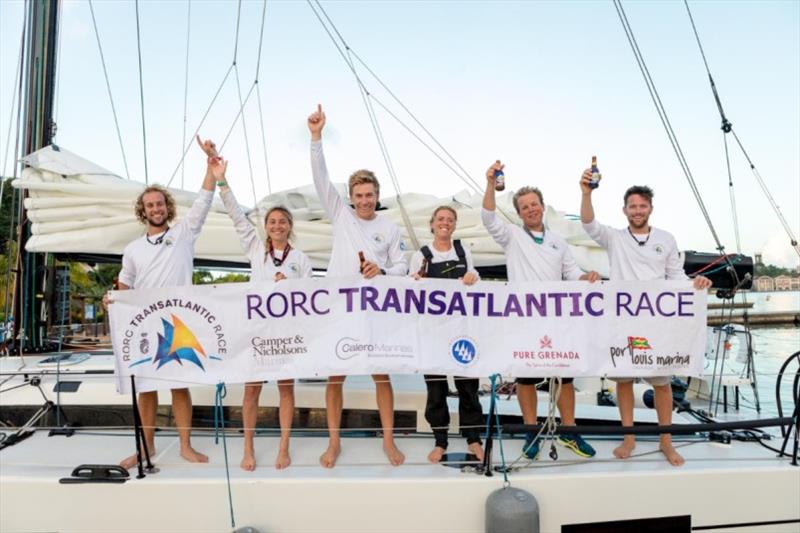 Team Pata Negra: Conor Totterdell, Cat Hunt, Will Harris, Amy Seabright, Andy Lis and Calum Healey celebrate with an ice cold beer on arrival in Grenada photo copyright RORC / Arthur Daniel taken at Royal Ocean Racing Club and featuring the IRC class