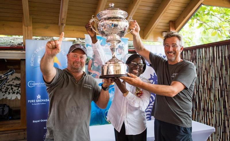 (R) Richard Palmer's JPK 10.10 Jangada, racing two handed with Jeremy Waitt (L) receive the magnificent RORC Transatlantic Race Trophy from Dr Clarice Modeste-Curwen, Minister for Tourism and Civil Aviation, Grenada photo copyright RORC / Arthur Daniel taken at Royal Ocean Racing Club and featuring the IRC class