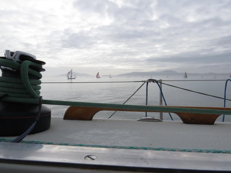 Limp kites struggle to lift as the fleet leaders drift down the East Bay flats. They pass the boats sailing upwind, coming the “wrong way” from Treasure Island - 2020 Three Bridge Fiasco - photo © Susan Burden