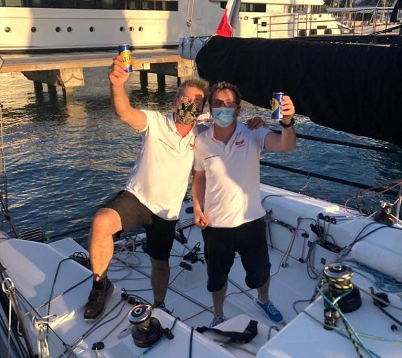 Enjoying a cold beer in Antigua after finishing the RORC Transatlantic Race: Sebastien Saulnier (R) and Christophe Affolter (L) racing Sun Fast 3300 Moshimoshi photo copyright Helen Spooner / RORC taken at Royal Ocean Racing Club and featuring the IRC class