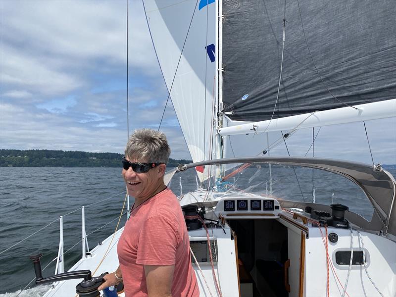 Jonathan McKee works the strings as Dark Star charges north on Puget Sound towards Port Madison - photo © David Schmidt