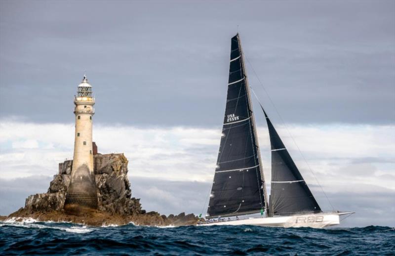 George David's Rambler 88 rounds the legendary Fastnet Rock. photo copyright Rolex / Carlo Borlenghi taken at Royal Ocean Racing Club and featuring the IRC class