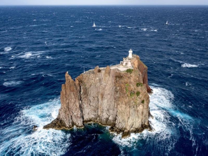 The Rolex Middle Sea Race fleet negotiate the passage close to Strombolicchio lighthouse photo copyright Kurt Arrigo / Rolex taken at Royal Malta Yacht Club and featuring the IRC class