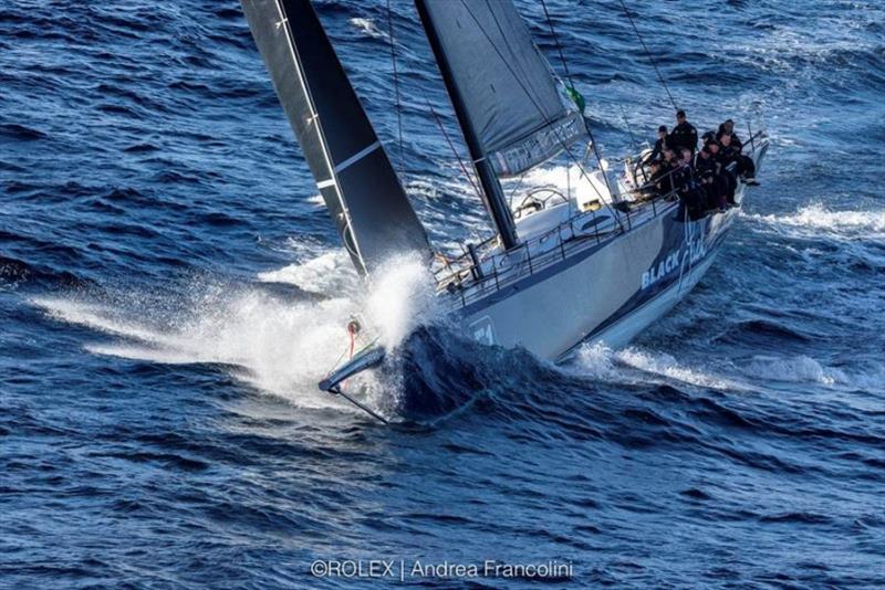 Peter Harburg's Black Jack powering around Tasman Island photo copyright Rolex / Andrea Francolini taken at Cruising Yacht Club of Australia and featuring the IRC class