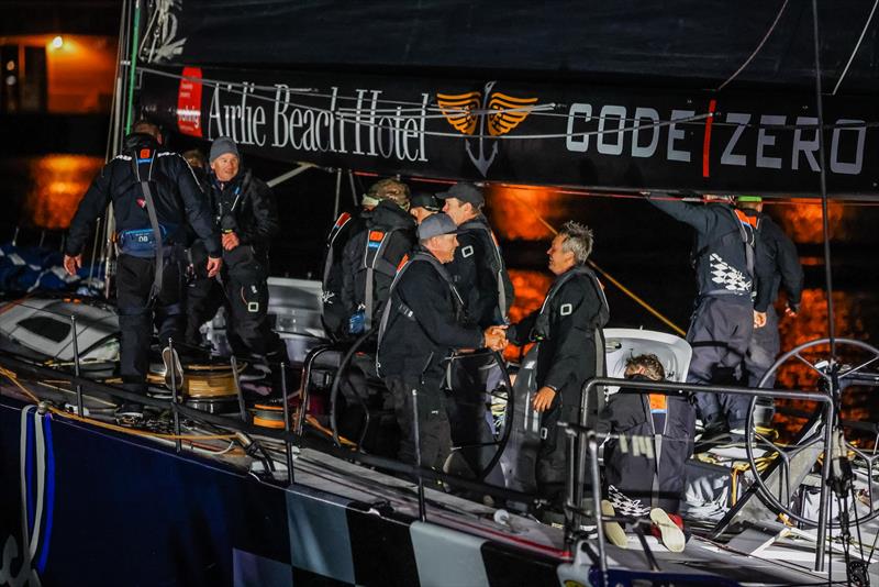 The supermaxi Black Jack, owned by Peter Harburg and skippered by Mark Bradford, at the finish of the 2021 Rolex Sydney Hobart Yacht Race  photo copyright Salty Dingo taken at Cruising Yacht Club of Australia and featuring the IRC class