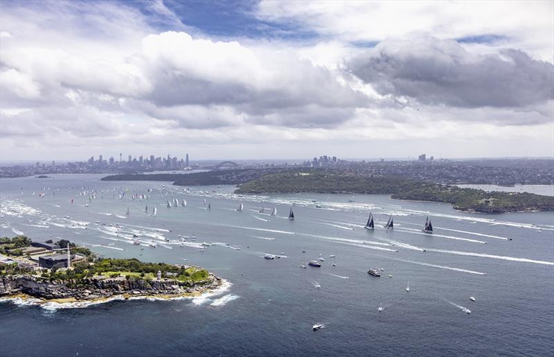 The three 100 foot (30.5 metre) maxis lead the fleet out of Sydney Harbour - 2021 Rolex Sydney Hobart Yacht Race photo copyright Rolex / Andrea Francolini taken at Cruising Yacht Club of Australia and featuring the IRC class