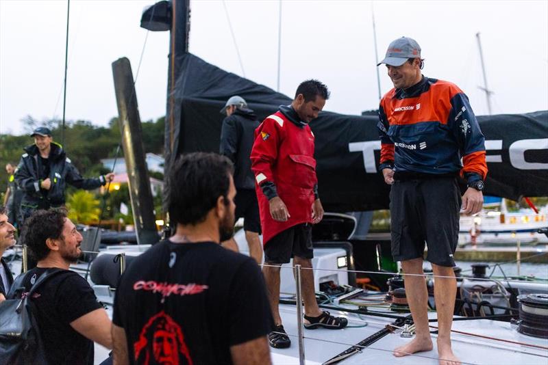 Great camaraderie between the teams as the crew of Comanche welcome L4 Trifork on the dock - RORC Transatlantic Race photo copyright Arthur Daniel / RORC taken at Royal Ocean Racing Club and featuring the IRC class