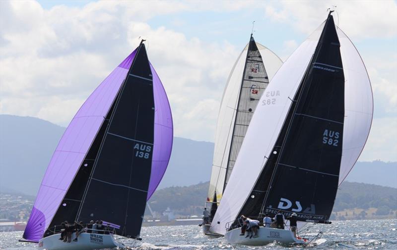 Cockwomble (left) and Assagai (right) neck and neck in Race 5 of the Combined Clubs Harbour Series in Hobart photo copyright Peter Watson taken at  and featuring the IRC class
