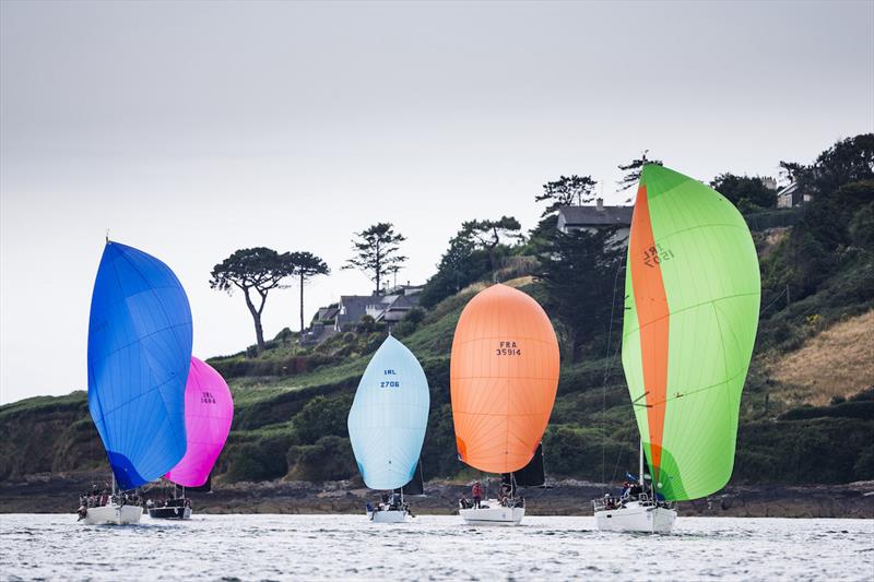 Racing under spinnaker off Weaver's Point, Crosshaven in the 16 nautical-mile Harbour Race that included a massed start and sailpast the historic town of Cobh at Volvo Cork Week 2018 organised by the Royal Cork Yacht Club photo copyright David Branigan / Oceansport taken at Royal Cork Yacht Club and featuring the IRC class